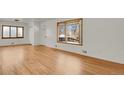 Bright living room with hardwood floors and large windows at 5648 E Greenwood Pl, Denver, CO 80222