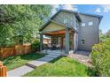 Charming two-story home boasting a covered front porch, neat landscaping and stone detail at 3770 Osceola St, Denver, CO 80212
