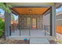 Attractive home features a covered front porch, neat landscaping, and easy access to the entrance at 3770 Osceola St, Denver, CO 80212