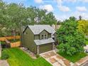 Aerial view of a well-maintained two-story home with a spacious lawn at 5370 S Union Way, Littleton, CO 80127