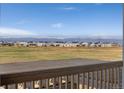 Scenic mountain views seen from the porch overlooking a community of single Gathering homes at 806 Flora View Dr, Erie, CO 80516