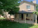 Relaxing backyard patio with covered seating area, perfect for enjoying the outdoors at 11600 E Adriatic Pl, Aurora, CO 80014