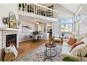 Cozy living room with a fireplace and hardwood floors at 7373 E Iowa Ave # 1108, Denver, CO 80231
