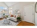 Open-concept living room with vaulted ceilings and large windows at 7373 E Iowa Ave # 1108, Denver, CO 80231