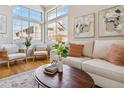 Bright living room with large windows and modern decor at 7373 E Iowa Ave # 1108, Denver, CO 80231