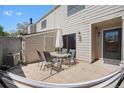 Relaxing outdoor patio features dining set and hammock for enjoying the fresh air at 7705 W 87Th Dr, Arvada, CO 80005