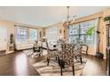 Open-concept living and dining area featuring elegant furnishings and abundant natural light at 13626 Garfield St # A, Thornton, CO 80602