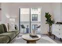 Comfortable living room with an exit to the balcony at 3500 S Corona St # 407, Englewood, CO 80113