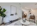 Airy living room with contemporary decor and open flow to the modern kitchen at 3500 S Corona St # 407, Englewood, CO 80113