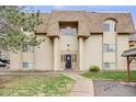 Exterior view of building with well-maintained lawn and manicured landscape at 7395 E Quincy Ave # 206, Denver, CO 80237