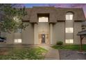 Charming exterior view of building with a well-maintained lawn and manicured landscape at 7395 E Quincy Ave # 206, Denver, CO 80237