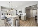 Modern kitchen with stainless steel appliances and an island at 9914 Truckee St, Commerce City, CO 80022