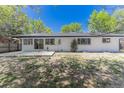 Spacious backyard featuring a concrete patio and ample room for outdoor enjoyment at 1486 S Kingston St, Aurora, CO 80012