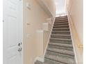 Entryway with a carpeted staircase leading to the upper level of the home at 2154 Concord Ln, Superior, CO 80027