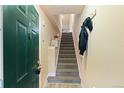 Inviting entryway with a coat closet and staircase leading to the living area at 2154 Concord Ln, Superior, CO 80027