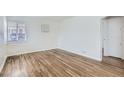 Bright living room with hardwood floors and large windows at 1716 Akron St, Aurora, CO 80010