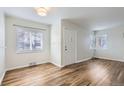 Living room featuring hardwood floors and neutral walls at 1716 Akron St, Aurora, CO 80010