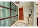 Stylish condo entryway with tile floor, closet and decorative accents at 191 Clayton Ln # 402, Denver, CO 80206
