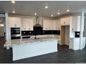 Spacious kitchen with marble countertops, stainless steel appliances and a large kitchen island at 16529 Black Rose Cir, Parker, CO 80134