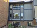 Building exterior featuring a gray and brick facade, with balconies, and windows at 850 W Moorhead Cir # 3F, Boulder, CO 80305