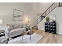 Bright living room with neutral colors, high ceilings, sleek floors, and modern decor elements at 17605 Ponderosa Ave, Parker, CO 80134