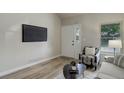 Neutral living area features sleek floors, ample natural light, and minimal decor at 17605 Ponderosa Ave, Parker, CO 80134