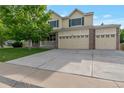 Inviting two-story home with a three-car garage and a well-maintained front yard at 5571 S Sicily St, Aurora, CO 80015