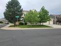 Lovely two-story home with a spacious front yard, mature trees, and a welcoming curb appeal at 5571 S Sicily St, Aurora, CO 80015