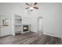 Cozy living room with fireplace, built-in shelves, and new floors for modern comfort at 4320 Snowbird Ave, Broomfield, CO 80020