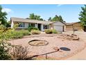 Ranch-style home featuring a tidy yard with stone and brick accents at 17601 E Eastman Pl, Aurora, CO 80013