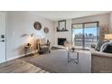 The living room boasts a fireplace, updated flooring, and a calming color palette at 499 Wright St # 308, Lakewood, CO 80228