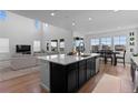 Bright, open kitchen with a large island and stainless steel appliances, perfect for entertaining at 8550 Cheraw St, Littleton, CO 80125