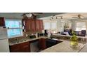 Well-lit kitchen with granite countertops, stainless steel appliances, and ample cabinet space at 2034 S Lincoln St, Denver, CO 80210
