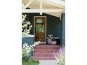 Inviting front entrance boasting a stylish wooden door and brick steps at 3410 W 31St Ave, Denver, CO 80211