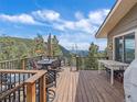 Spacious deck with outdoor furniture, offering scenic mountain views at 13288 Elsie Rd, Conifer, CO 80433