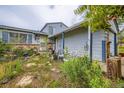 Exterior view of home with blue siding and well-maintained yard at 17232 E Oberlin Pl, Aurora, CO 80013