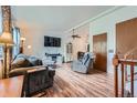 Cozy living room featuring wood floors and a large window at 17232 E Oberlin Pl, Aurora, CO 80013