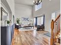 Bright living room with hardwood floors, high ceilings, and lots of natural light at 1607 Rosedale St, Castle Rock, CO 80104