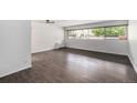 Bright living room with large window and hardwood floors at 888 N Logan St # 2E, Denver, CO 80203
