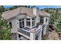This house features a balcony with outdoor seating for relaxing and enjoying the outdoors at 730 Summerwood Dr, Golden, CO 80401
