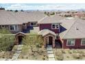 An aerial view of the house showcasing its architecture and surrounding neighborhood at 8552 Gold Peak Ln # F, Highlands Ranch, CO 80130