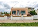 Attractive exterior view showing a well-maintained home with stylish trim and a landscaped front yard at 1803 E 36Th Ave, Denver, CO 80205
