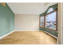 Inviting living room featuring hardwood floors, neutral paint, and ample natural light at 17943 E Bates Ave, Aurora, CO 80013