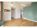 Spacious living room with hardwood floors, showcasing an open and airy atmosphere at 17943 E Bates Ave, Aurora, CO 80013