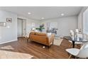 Open living space featuring hard surface floors, fresh paint, and plenty of natural light at 1275 Winona Ct # B, Denver, CO 80204