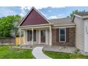 Inviting front porch and meticulously maintained lawn and landscape at 12665 Grove Ct, Broomfield, CO 80020