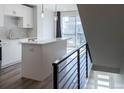 Open kitchen with modern white cabinets, stainless steel appliances, and quartz countertops at 2350 Tremont Pl # 19, Denver, CO 80205