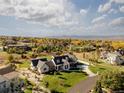 Aerial view of a luxurious home on a large lot with mountain views at 6816 Goldbranch Dr, Niwot, CO 80503