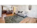 Bright living area showcasing stylish decor, hardwood floors, and seamless open-concept design at 2285 Fulton St, Aurora, CO 80010