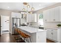 Bright kitchen featuring stainless steel appliances, white cabinets, and quartz countertops at 1534 Meade St, Denver, CO 80204